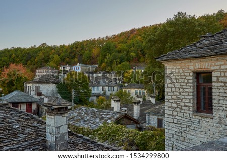 Traditional old stone houses in the picturesque village of Dilofo in Zagorochoria, Epirus, Western Greece Royalty-Free Stock Photo #1534299800
