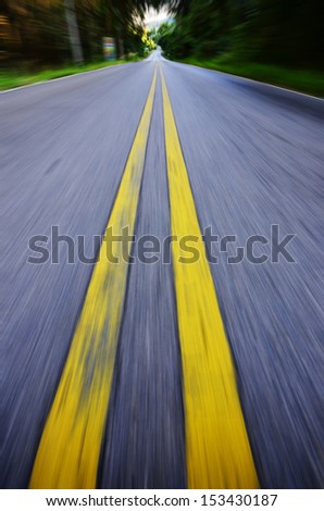 Empty asphalt blurry road