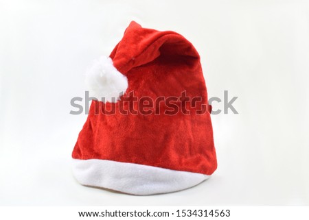 Red christmas hat on white background.