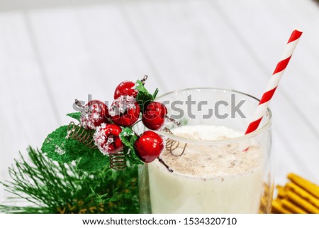 Composition with Christmas cookies and milk on white background