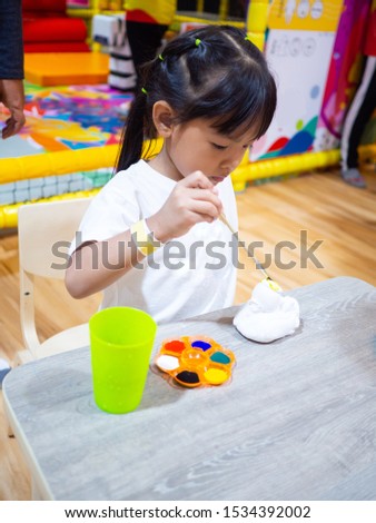 little girl  paint On the Plaster