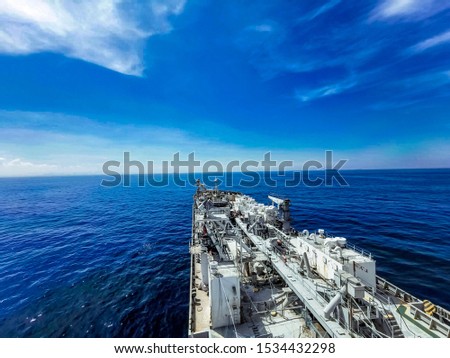 Cargo and Cement ships that run in the middle of the sea are transported cement to the port.