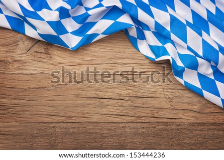 Oktoberfest blue checkered fabric on wooden background