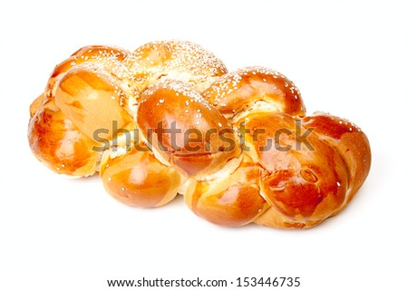 One light braided challah with seeds isolated on white background