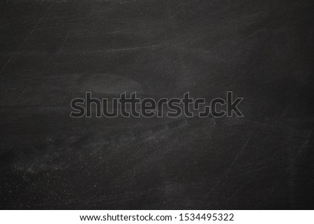 Abstract texture of chalk rubbed out on blackboard or chalkboard background, can be use for advertisement, background, education, banner or website concept.