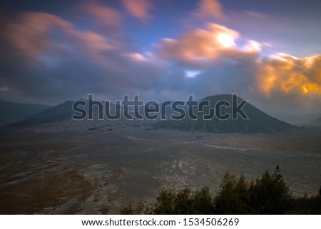 Mount Bromo volcano (Gunung Bromo) during sunset from viewpoint (clouds in an motion)