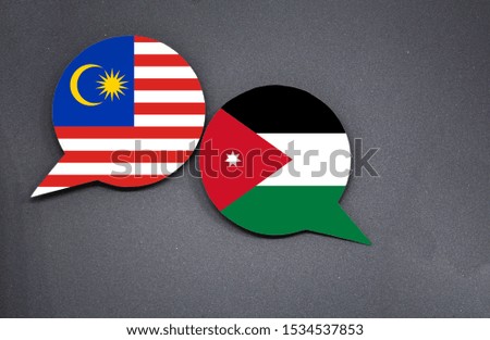 Malaysia and Jordan flags with two speech bubbles on dark gray background