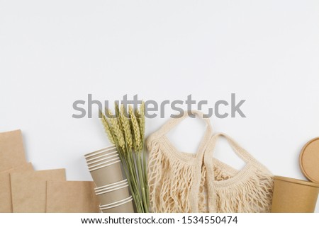 eco natural paper cups, string bag, wheat. flat lay on white background. sustainable lifestyle concept. zero waste, plastic free items. stop plastic pollution. Top view, overhead, template, Mockup.