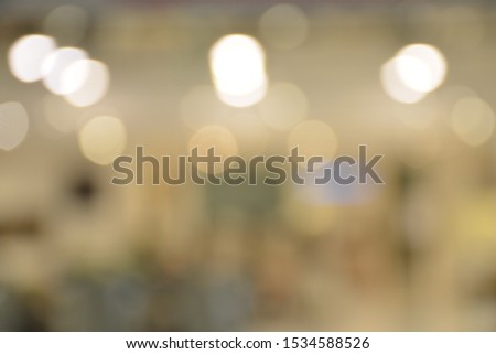 Abstract blur image of luxury shopping mall with bokeh lights,use for backdrop or web design,interior design.