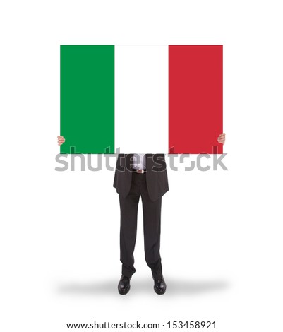 Businessman holding a big card, flag of Italy, isolated on white