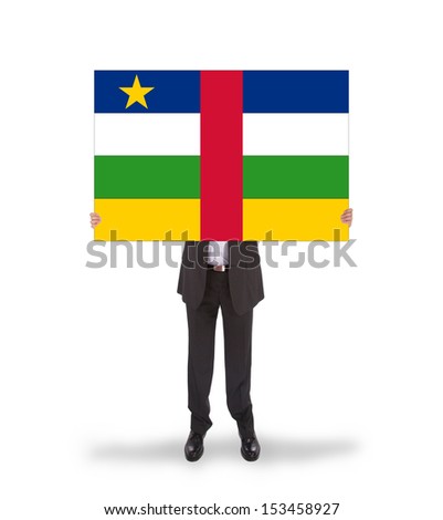 Businessman holding a big card, flag of CAR, isolated on white