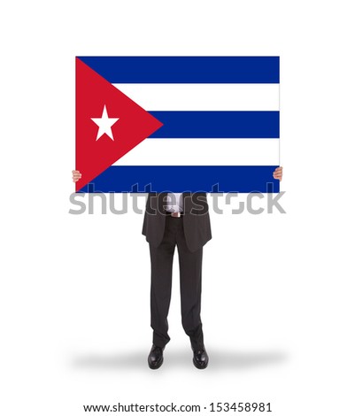 Businessman holding a big card, flag of Cuba, isolated on white