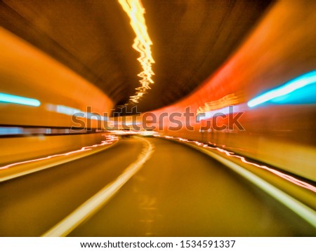 Tunnel ride. Smudged lights and selective focus.