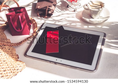 Black friday sale concept. Woman's hands hold tablet and make online purchase, online shopping on black friday