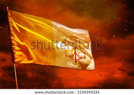 Fluttering Holy See flag on crimson red sky with smoke pillars background. Holy See problems concept.