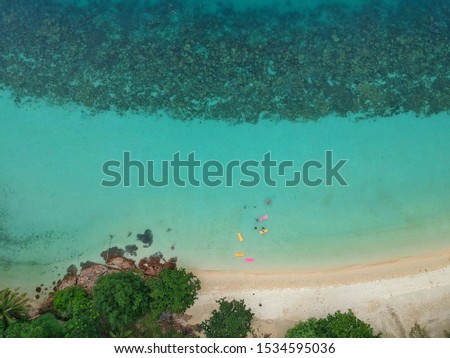 Aerial view or high view from Drone, beautiful blue sea ,white sand beach and coral. the picture for nature background or texture. at Ko Wai island ,Thailand , Asia