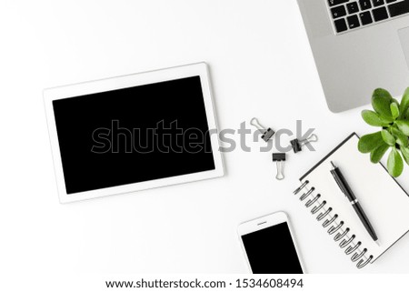 Minimalist workspace with business accessories and digital tablet with empty screen. Office desktop