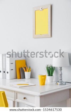 Modern stylish workplace near white wall