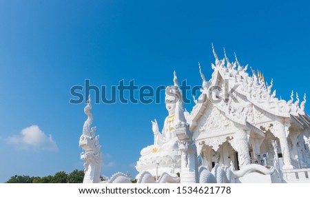 Beautiful Big White Guan Yin Statue and White Dragon at Wat Huay Pla Kang Buddhist Temple. Landmark of Chiang Rai. Located in Thailand. Picture for Chiang Rai Travel Concept.