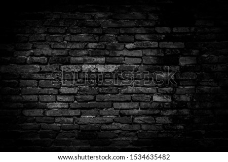 Black brick walls background and texture. The texture of the brick is black. Background of empty brick basement wall. black wall.