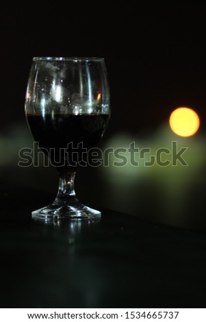 Glass of wine on a dark background