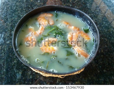 Tacaca is a specialty cuisine Amazon. Served in a natural bowl, tucupi boiling is poured over a gum made from tapioca flour. It adds a generous portion jambu leaves and dried shrimp completes the dish Royalty-Free Stock Photo #153467930
