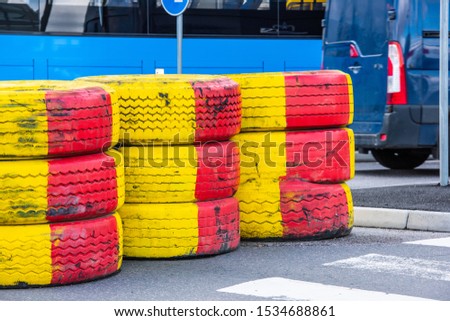 Tyre barriers protecting road works.