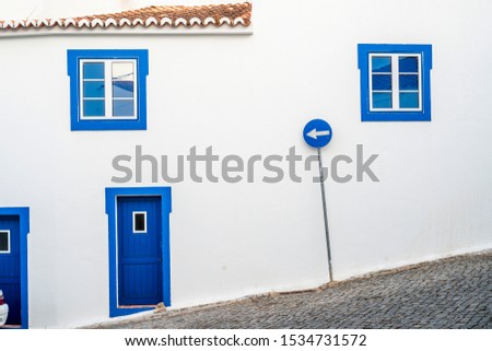 Blue windows, doors and road sign in mediterranean village, Acoutim, Portugal