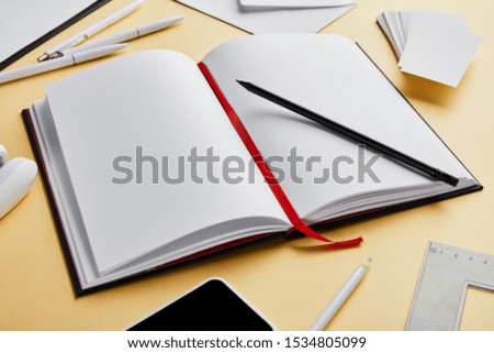 envelope, pens, pencil, notebook, business cards, smartphone with copy space 