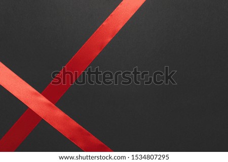 Red silk ribbon on table