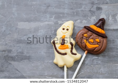 top view scary Halloween cookie on ceramic background