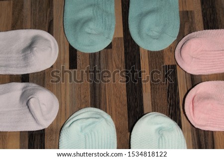 Multi-colored socks many different socks for cold seasons socks are scattered on a bright background