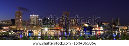 Colorful Baltimore skyline and Inner Harbor at dusk, USA