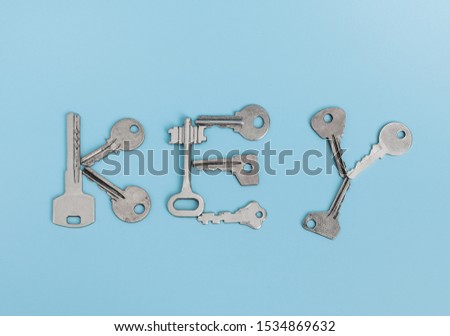 inscription with keys the words key on a blue background