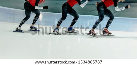 legs group athletes ice skaters training speed skating