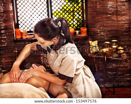 Man  having oil Ayurveda spa treatment.