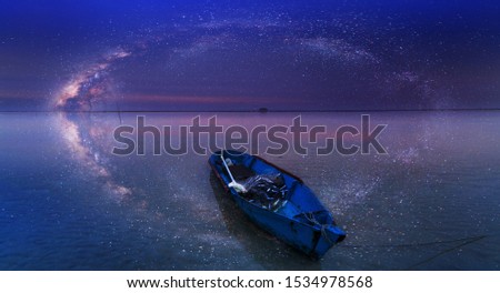 Abstract seascape with Milky Way Galaxy and it's reflection for background.