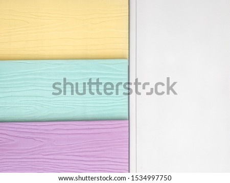 Multicolor background on a garden fence