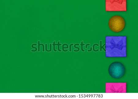 Creative Composition Useful for Christmas and New Year Greeting Card Colorful Gift Boxes and Decorative Balls on The Right Side. Copy Space on The Left Side