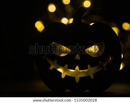 Silhouette of scary wood made pumpkin. Background for Halloween celebration