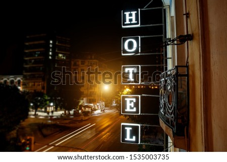 Hotel plate over night city
