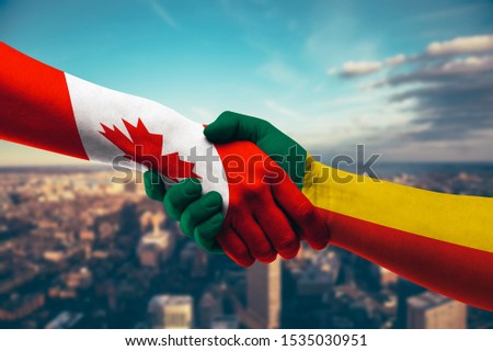 Shaking hands Canada and Benin