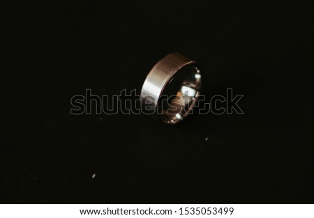 Men's Silver wedding band on black background