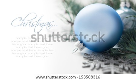 Blue and silver christmas decorations with space for text