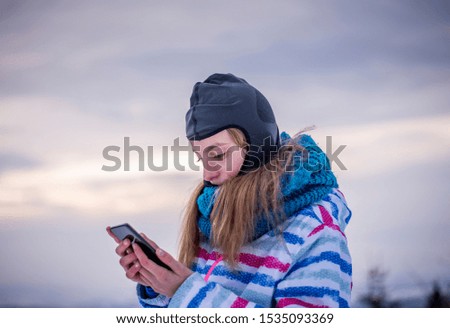 pensive young girl with smartphone
