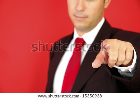 Business man pointing on the red background