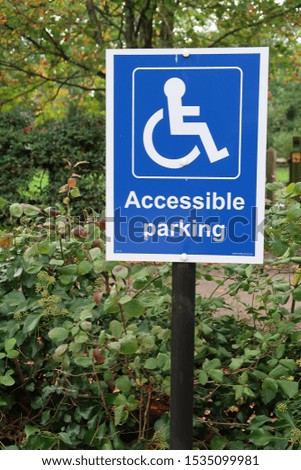Disabled reserved parking space sign.