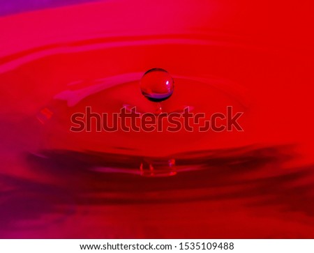 Amazing highspeed macro shot of colorful waterdrop