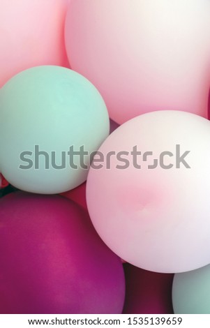 Close-up vertical image of balloons of various pleasant colors. Congratulations, celebrations, birthdays. background