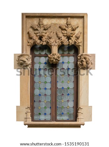 Elements of architectural decoration of buildings, old windows and arches on the streets in Barcelona, public places. Windows of ancient buildings decorated with stucco.